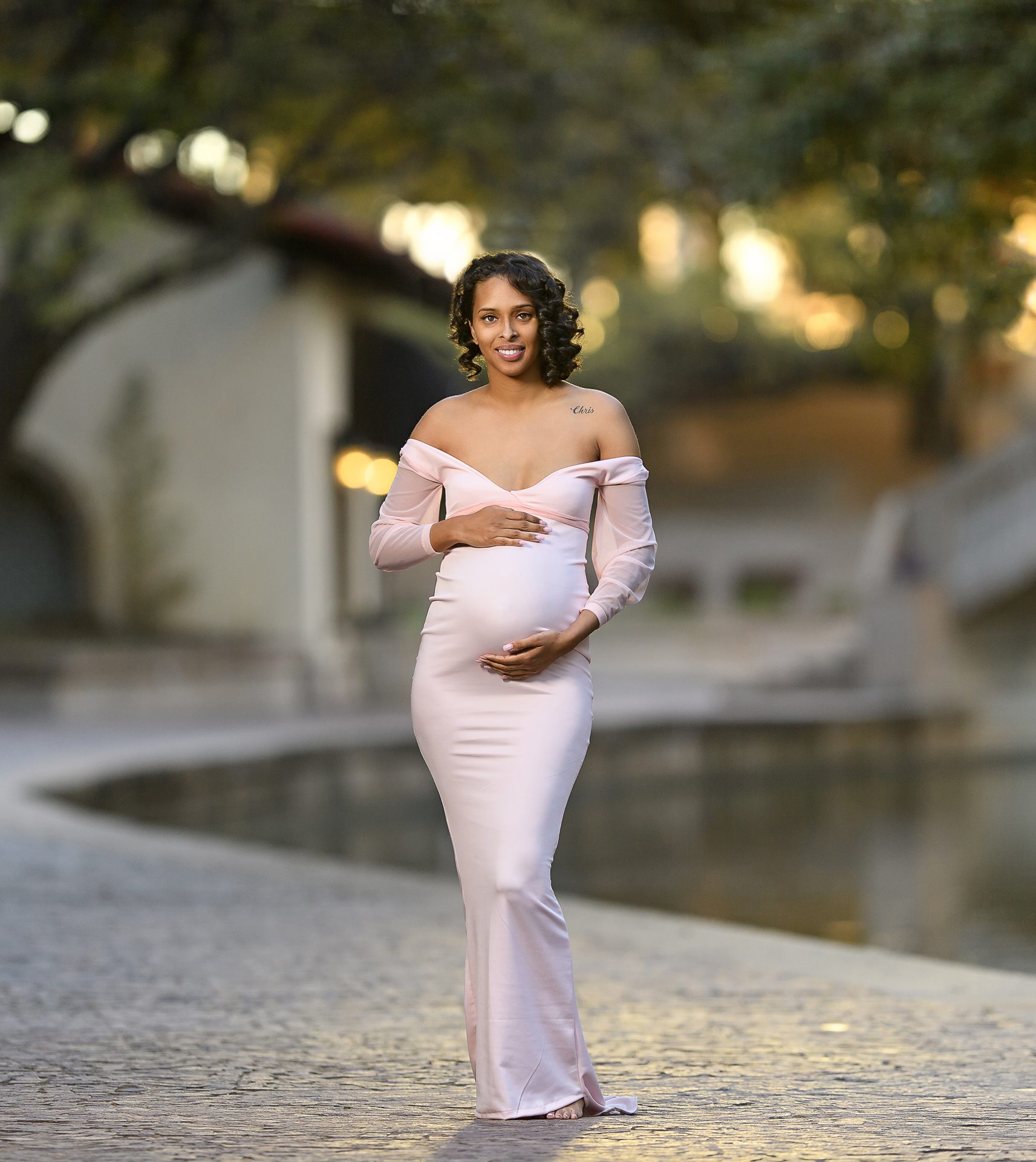 A woman posing for maternity photography - Natalie Roberson Photography