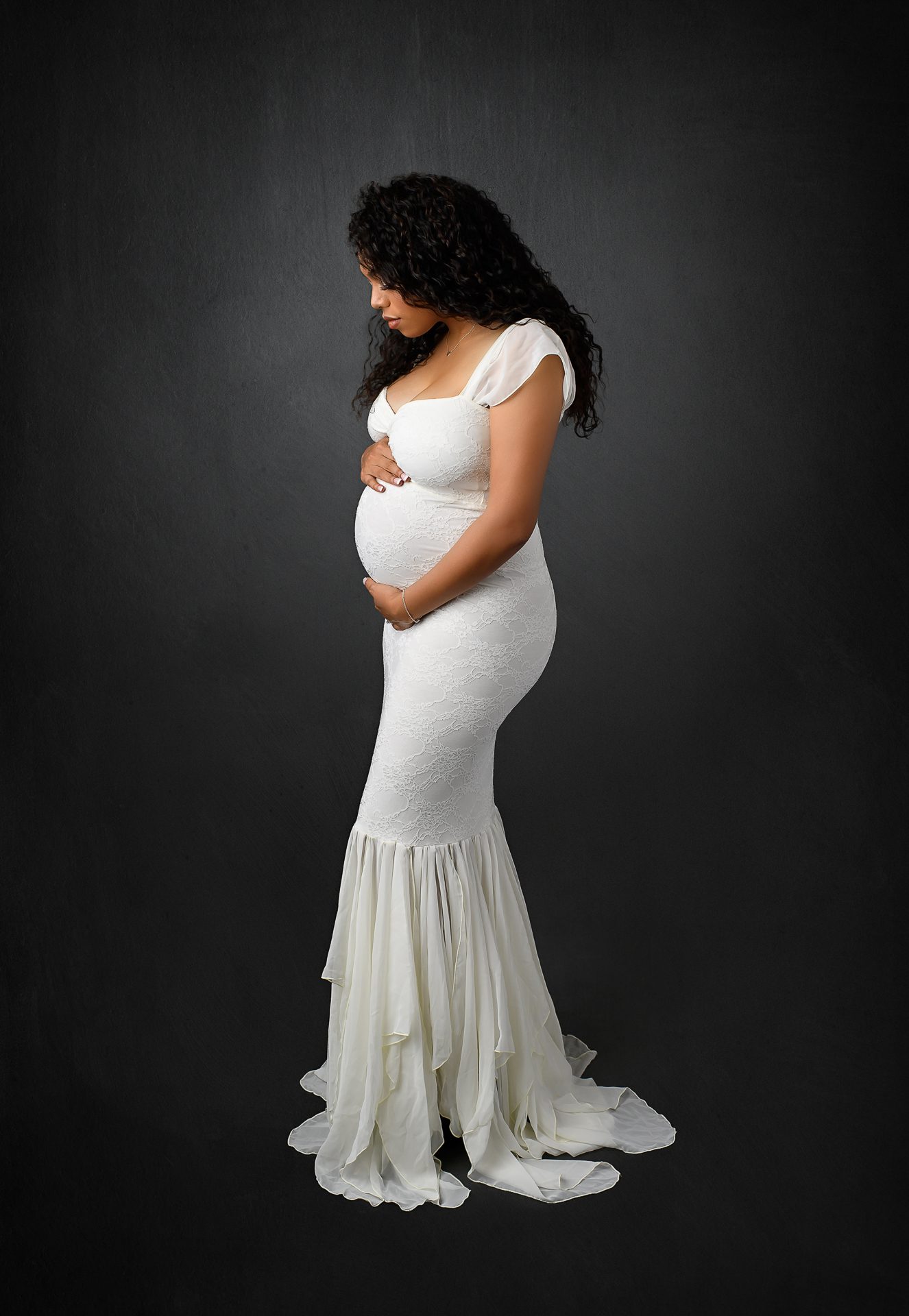 A mother to be posing for maternity photography - Natalie Roberson Photography