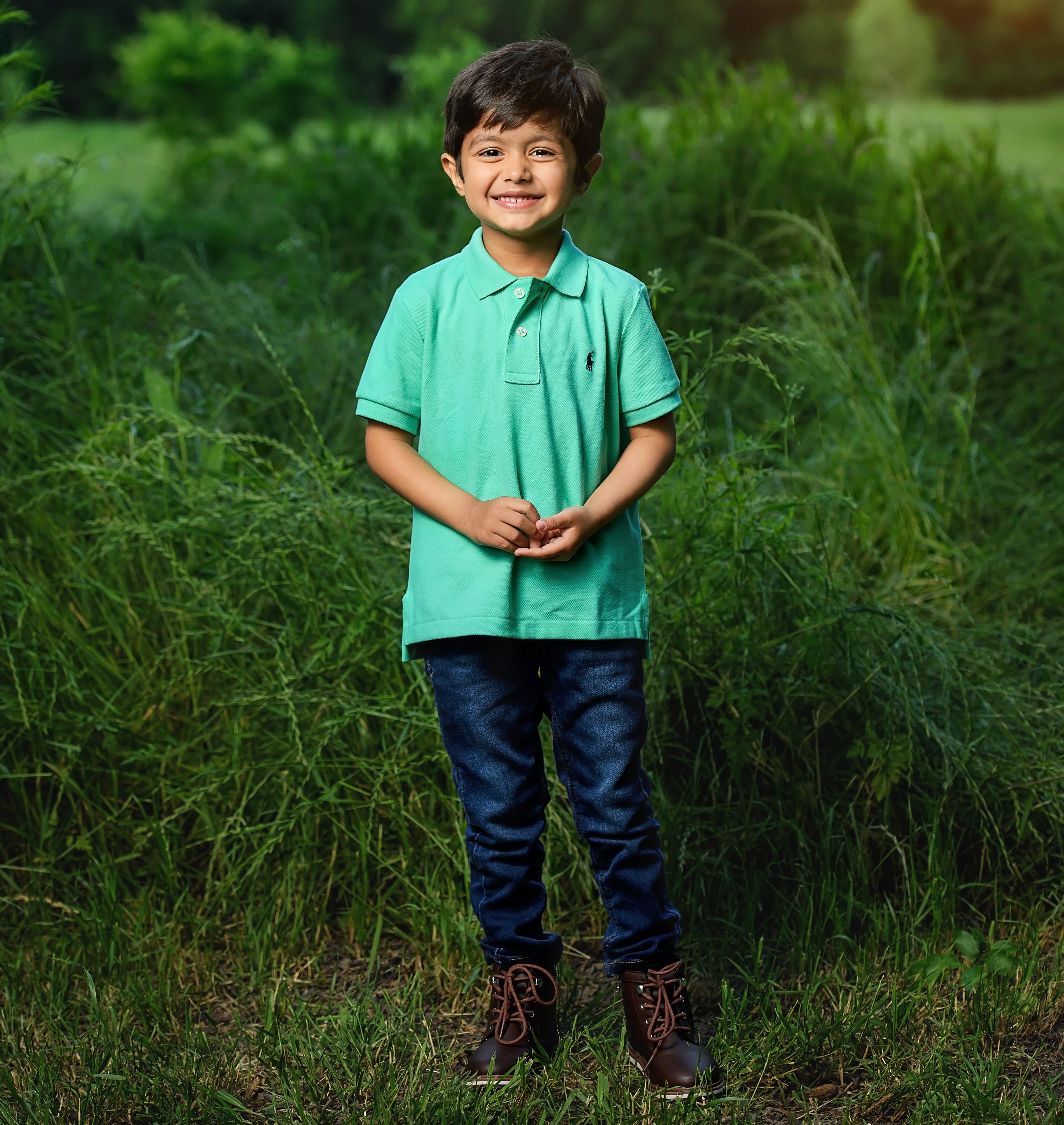 Photograph of child standing and smiling for children’s photography - Natalie Roberson Photography