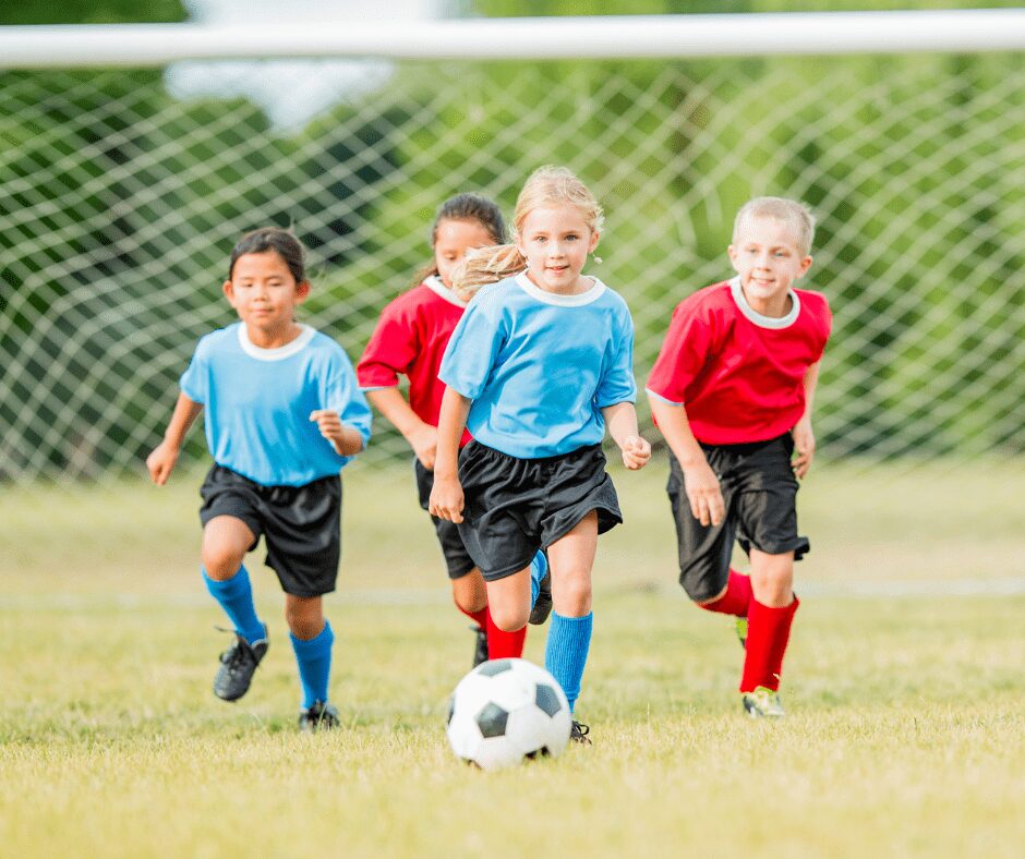 sports action photography of​ children Soccer team