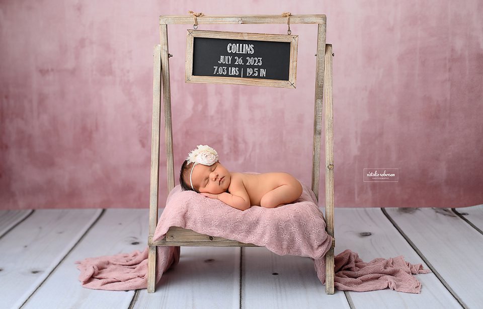 Baby posing on cradle- Newborn Photography
